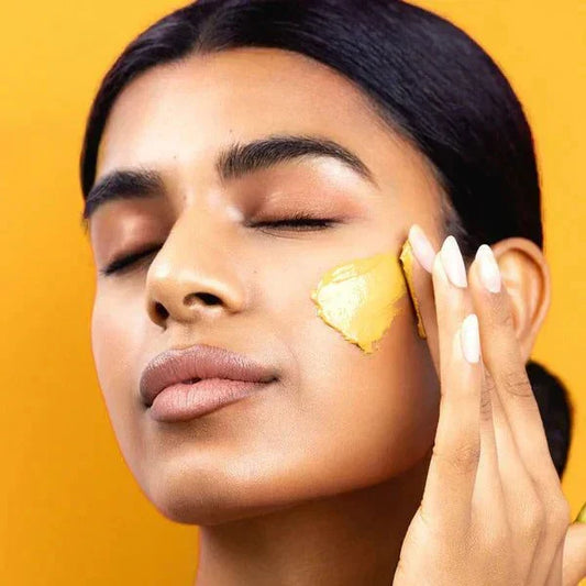 Turmeric Vitamin C face mask peeling off to cleanse and brighten skin