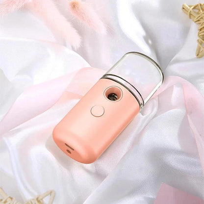 Compact Nano Face Mist Hydration Sprayer producing ultra-fine cooling mist for instant skin refreshment and deep moisture absorption
