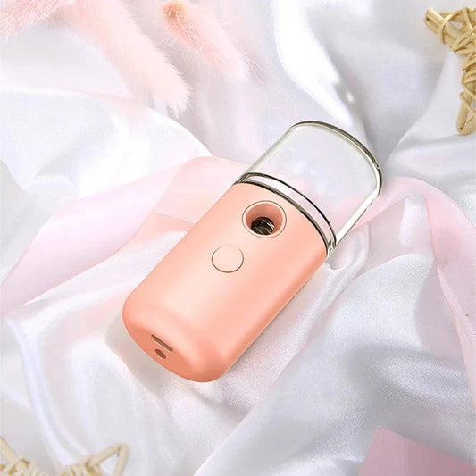 Compact Nano Face Mist Hydration Sprayer producing ultra-fine cooling mist for instant skin refreshment and deep moisture absorption