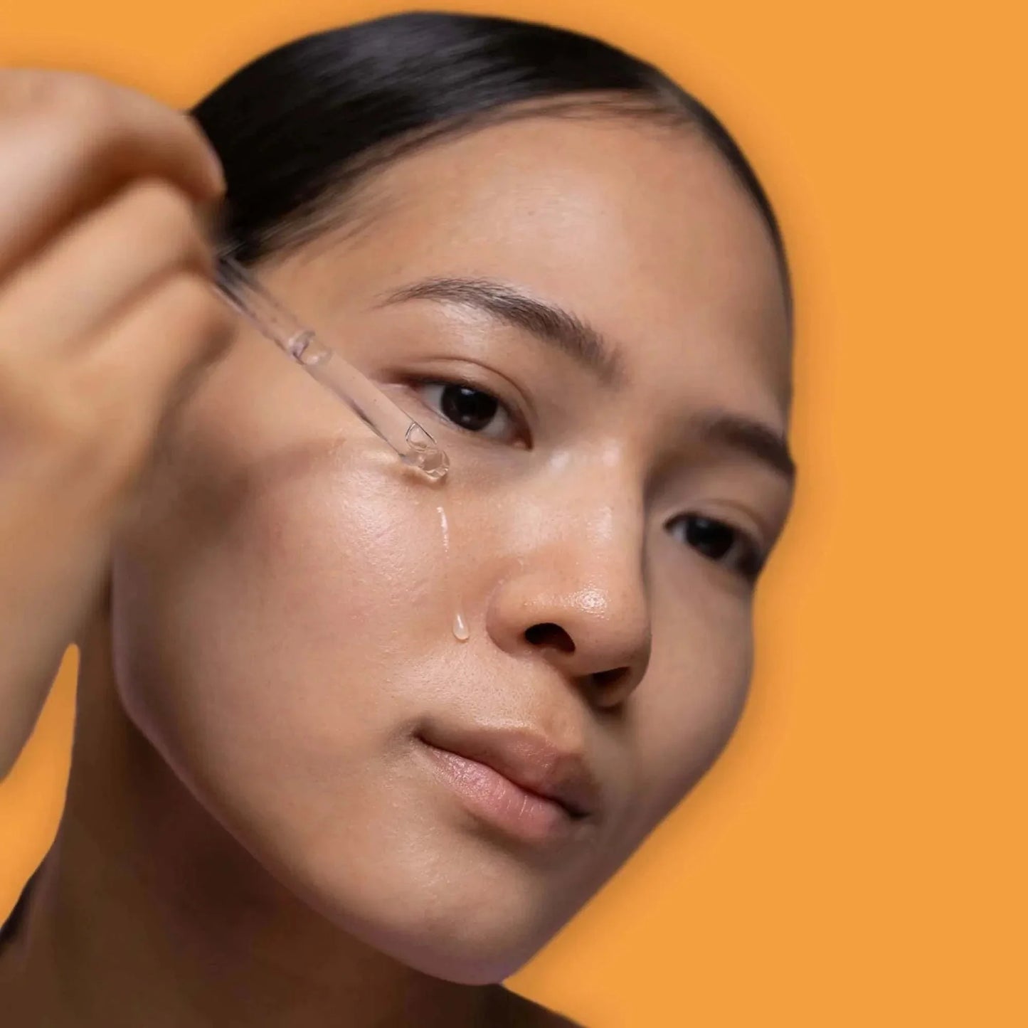 Turmeric Radiance Serum bottle with turmeric roots and leaves, natural skincare for dark spots and even skin tone