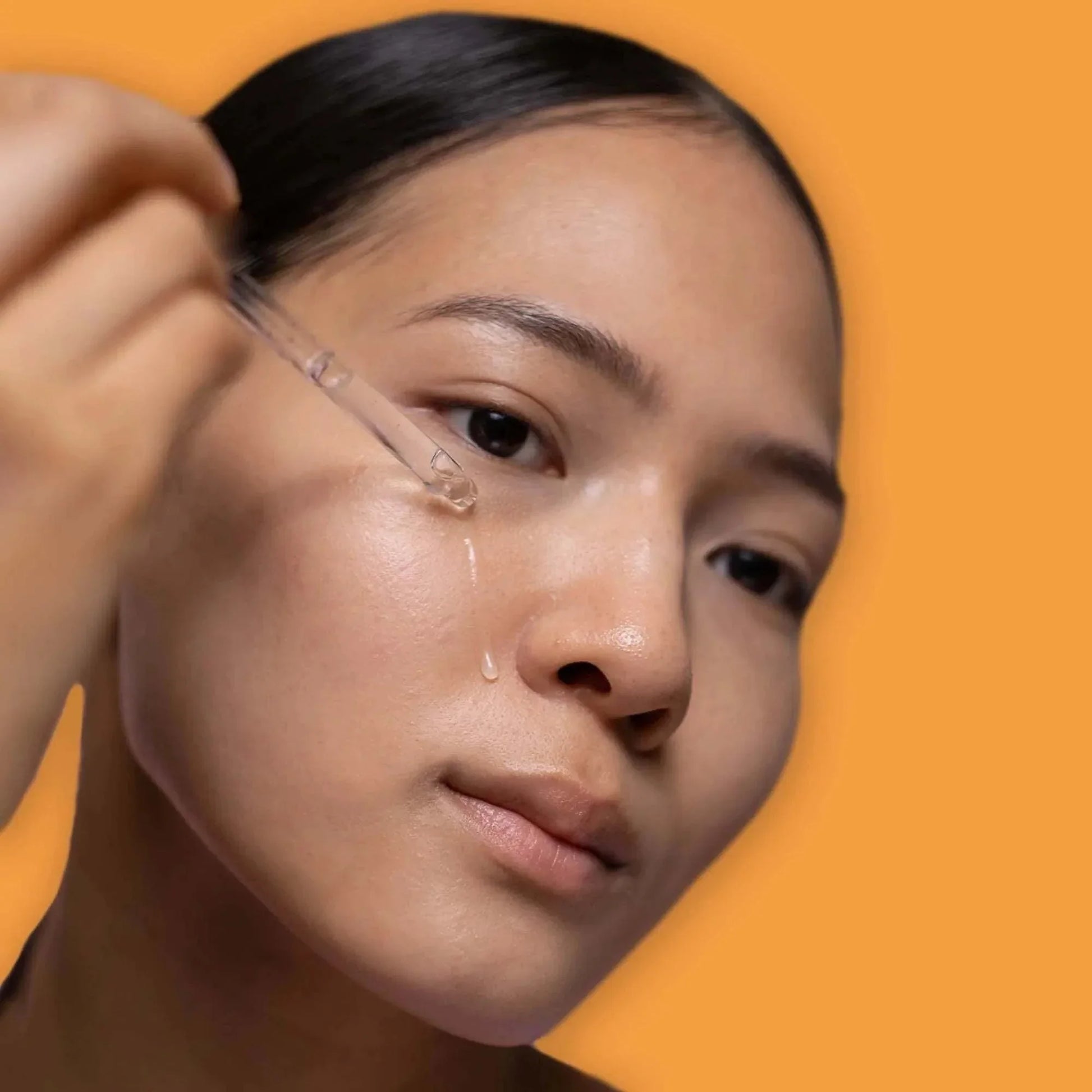 Turmeric Radiance Serum bottle with turmeric roots and leaves, natural skincare for dark spots and even skin tone